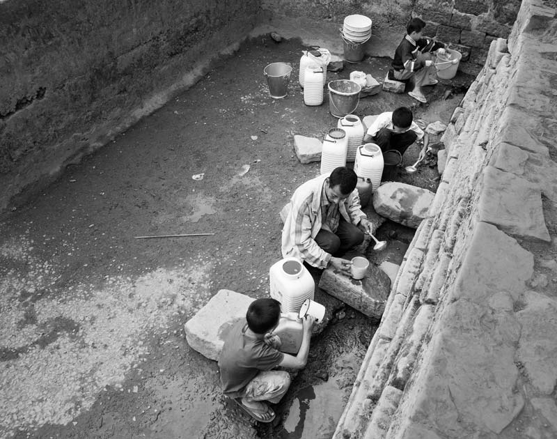 Human Right to Water in Nagaland - Extracting drops of precious water from a dried-up unprotected spring-fed tank in Mokokchung district